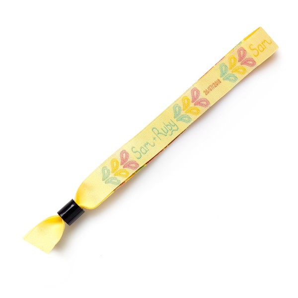 A yellow fabric wristband with coloured petals and the names Sam & Ruby woven into them.